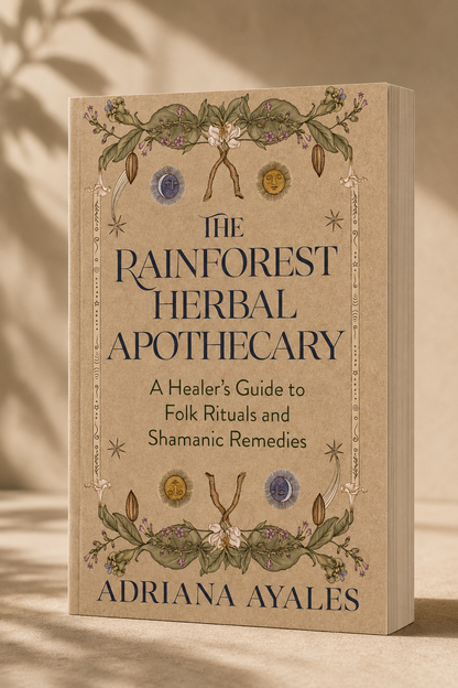 The Rainforest Herbal Apothecary book by Adriana Ayales, featuring a beige cover with botanical illustrations and dark blue text, set against a warm beige background with soft leaf shadows.