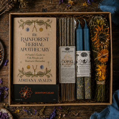 A curated apothecary gift box set on a rustic dark wood background, featuring &