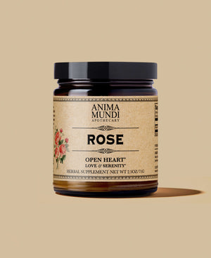 A jar of ANIMA MUNDI Rose powder with a label that features a rose illustration and text detailing the product as 'Open Heart' Love & Serenity'.
